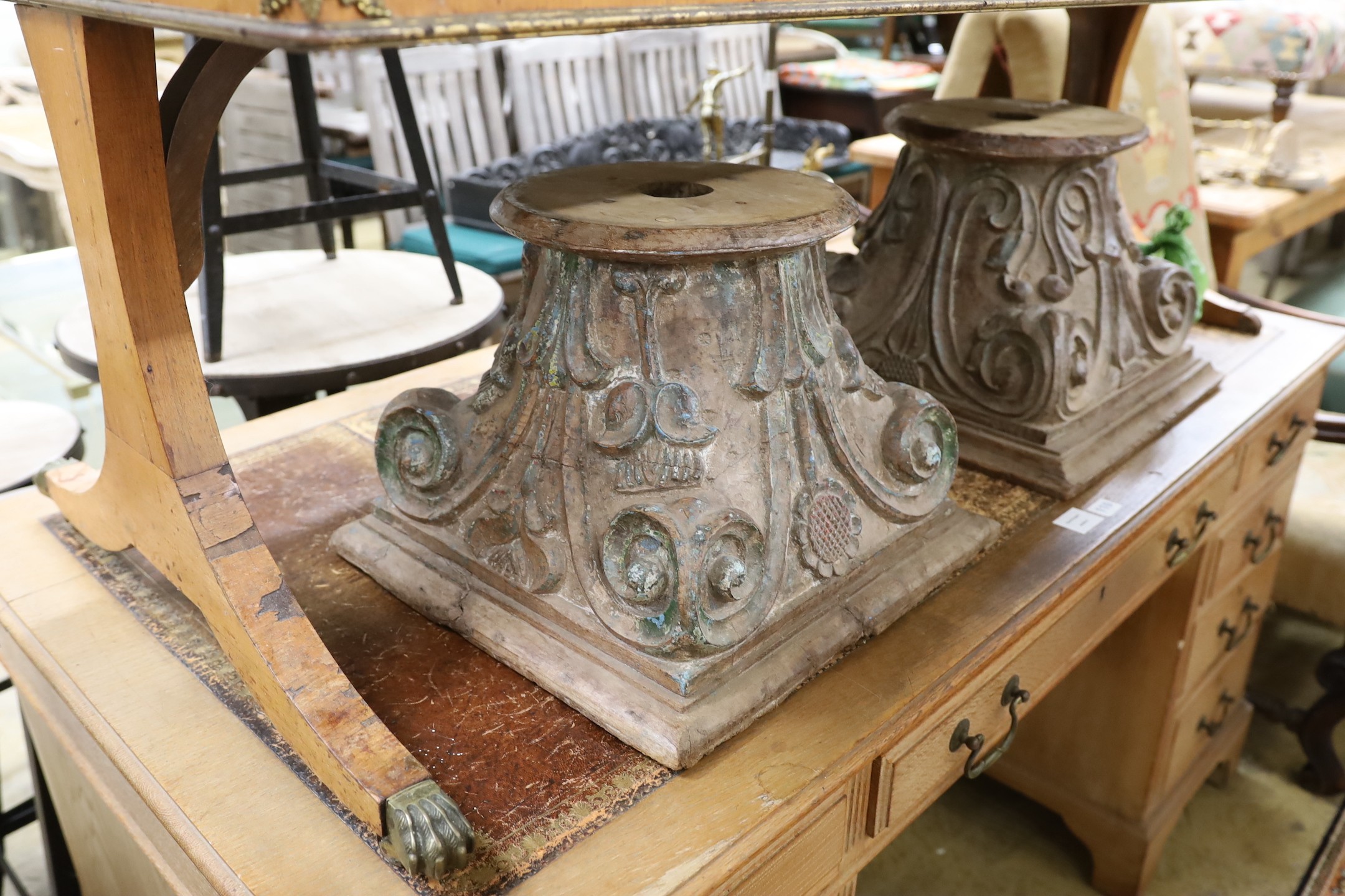 A near pair of carved and painted wood Corinthian column capitals, width 41cm, depth 41cm, height 31cm